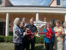 Chamber Of Commerce Ribbon Cutting in front of Office