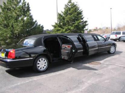 Black 5th door 10 passenger Lincoln Towncar