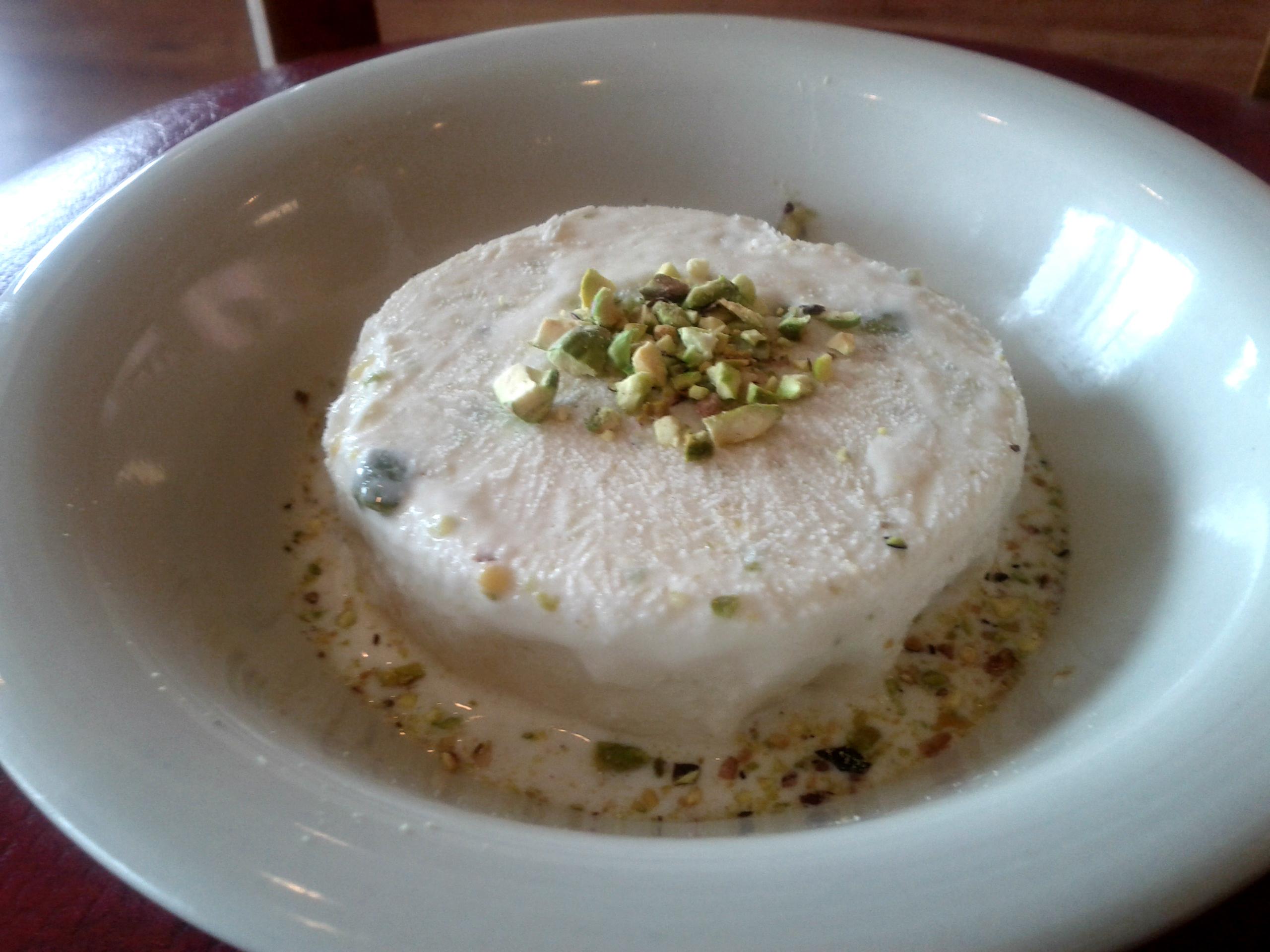 Kulfa- This unique, frozen delight is creamy with hints of cardamom and topped with fresh pistachios!