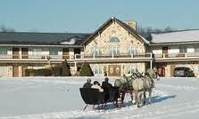 Horsedrawn sleigh ride in front of Guggisberg Swiss Inn