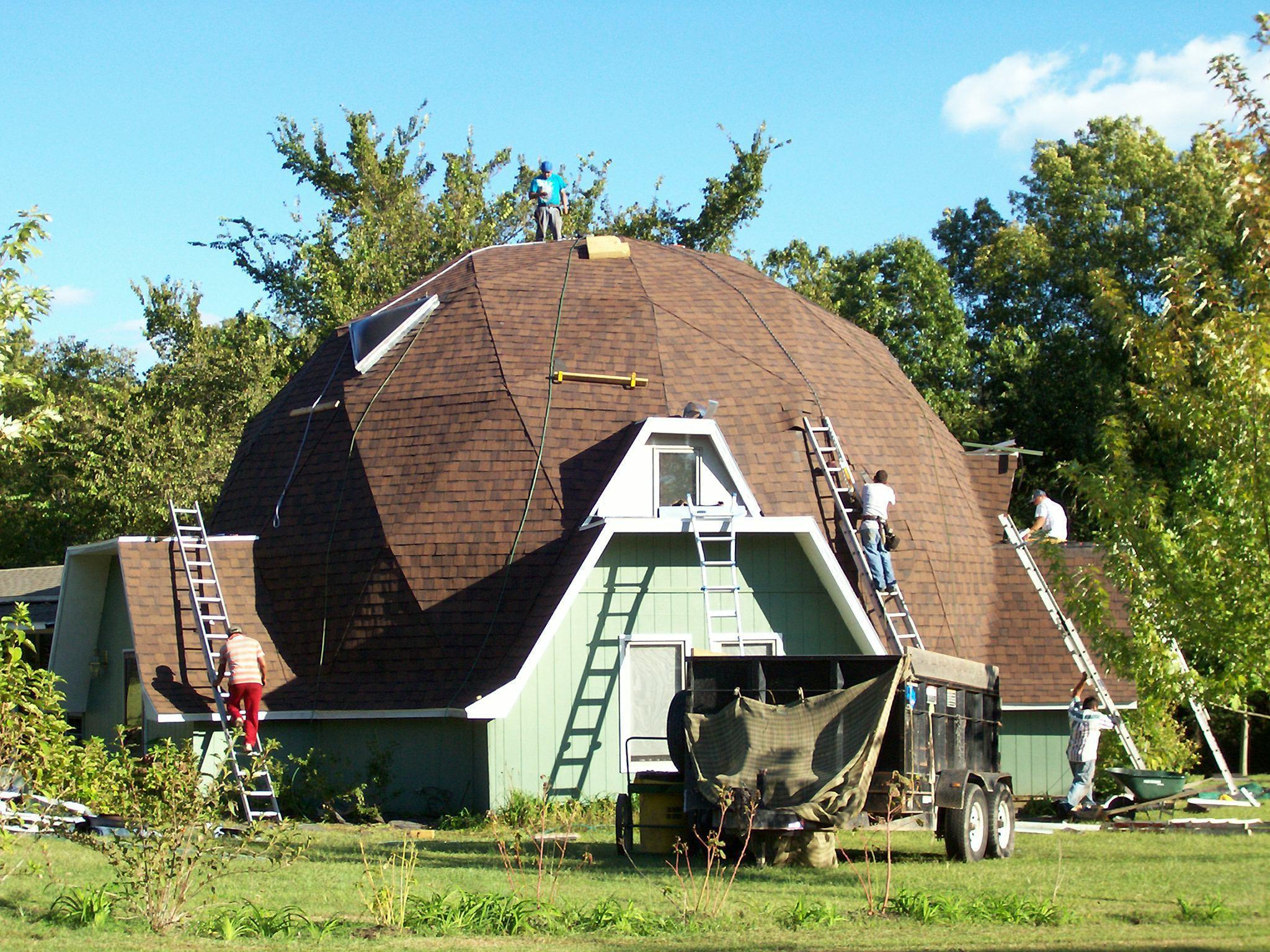 Shingle installation on a geodesic dome house by NWA Roofing