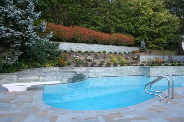 Mignone Masonry Pool Patio with hot tub, steps and retaining wall.