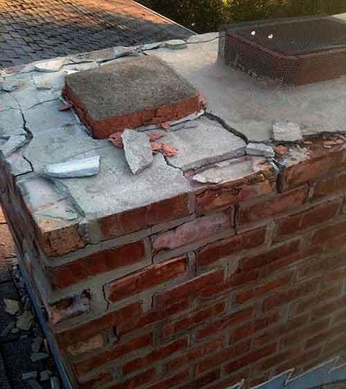 Chimney in dire need of repair - Cracked brick eroding mortar.