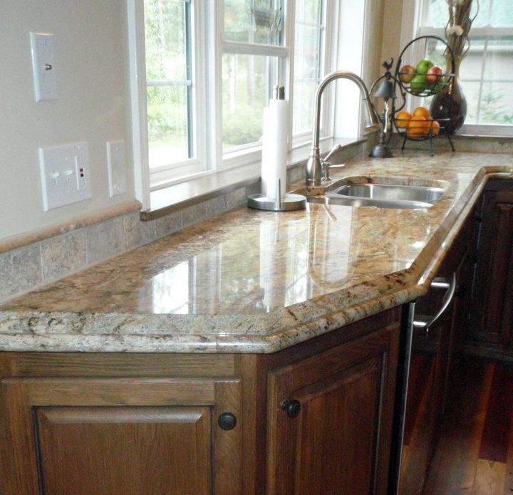 A remodeled kitchen featuring a custom built-up edge and tile splash.