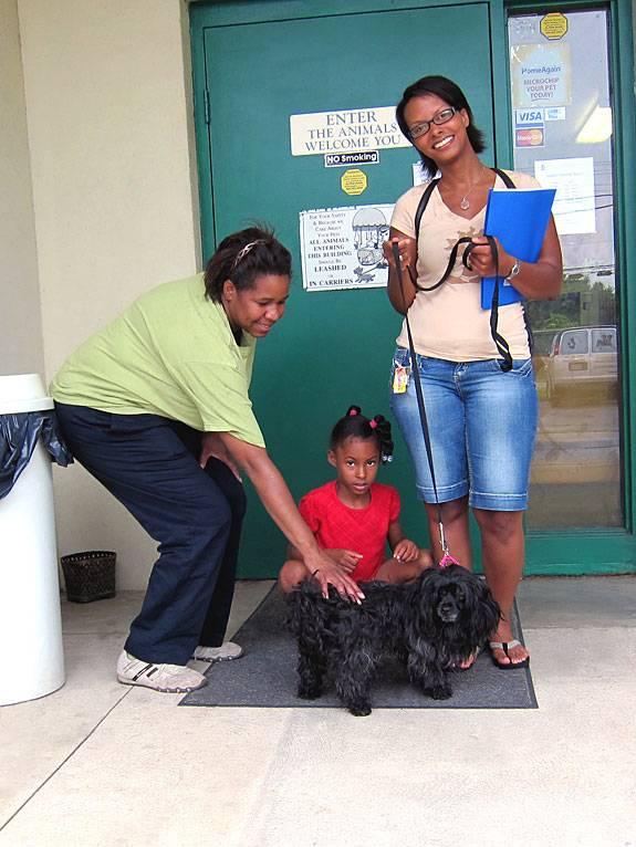 Happy adopters with their new family member