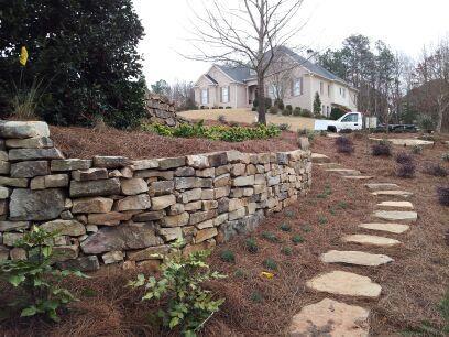 Landscape design plan installed. Close up of a stone wall installed.