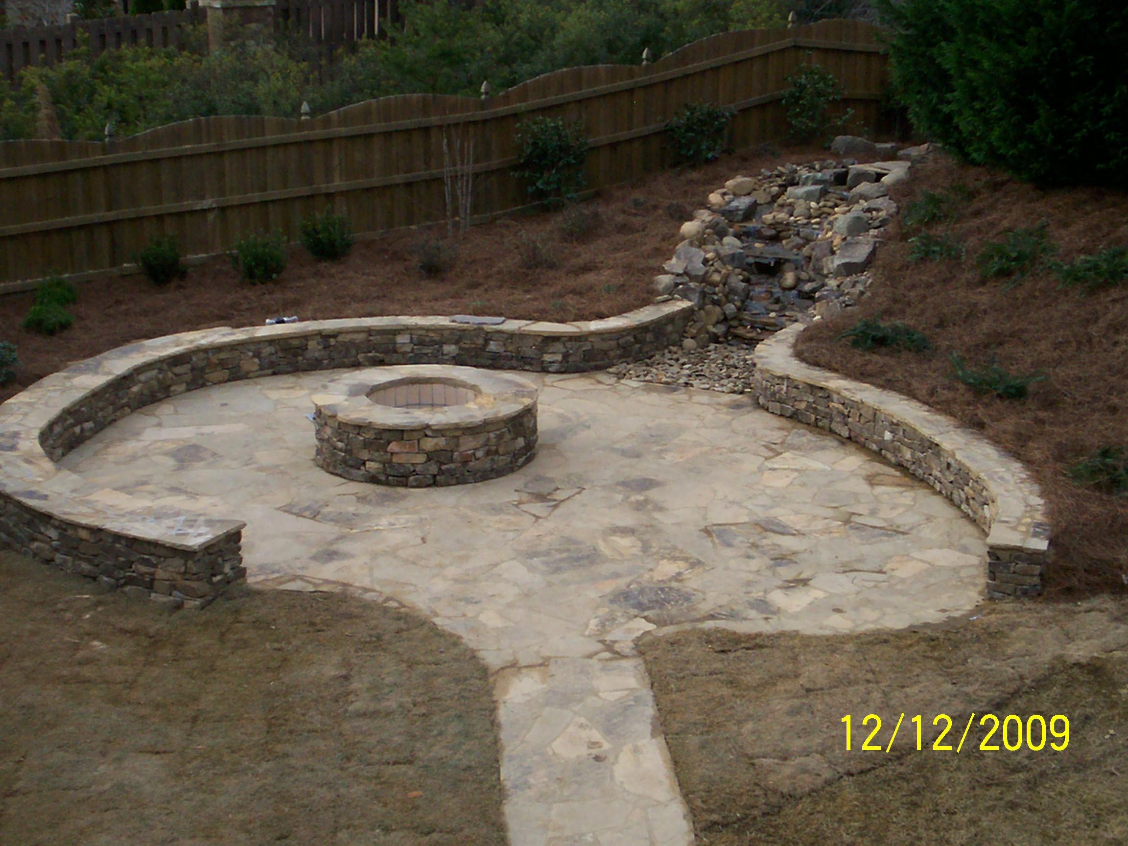 Entertainmnet Space: Pondless Waterfall, Fire Pit, Knee Wall, Patio & Walkway with new sod, pinestraw and shrubs