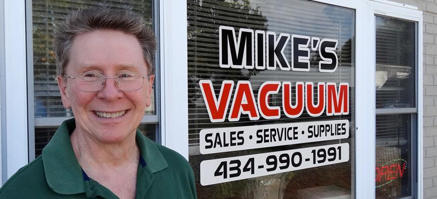 Mike Coleman, Owner of Mike's Vacuum in front of his shop