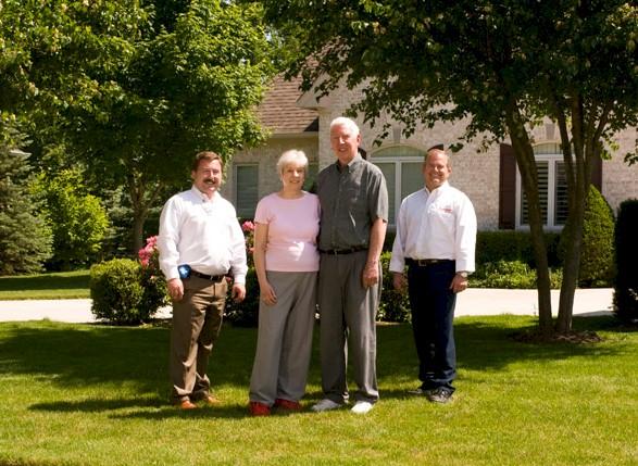 Johnson team members with local customers at their home.