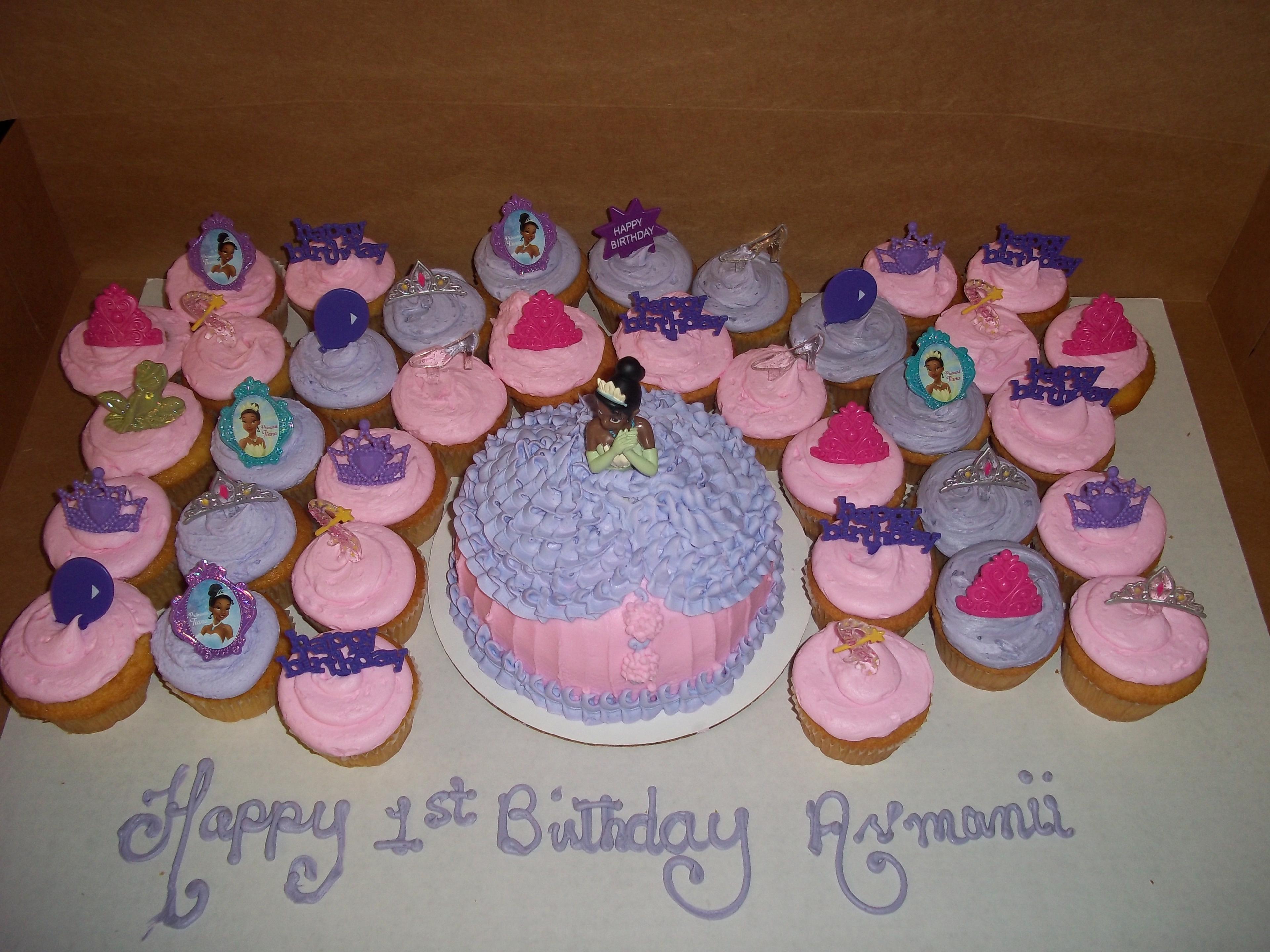 doll cake w/ surrounding cupcakes