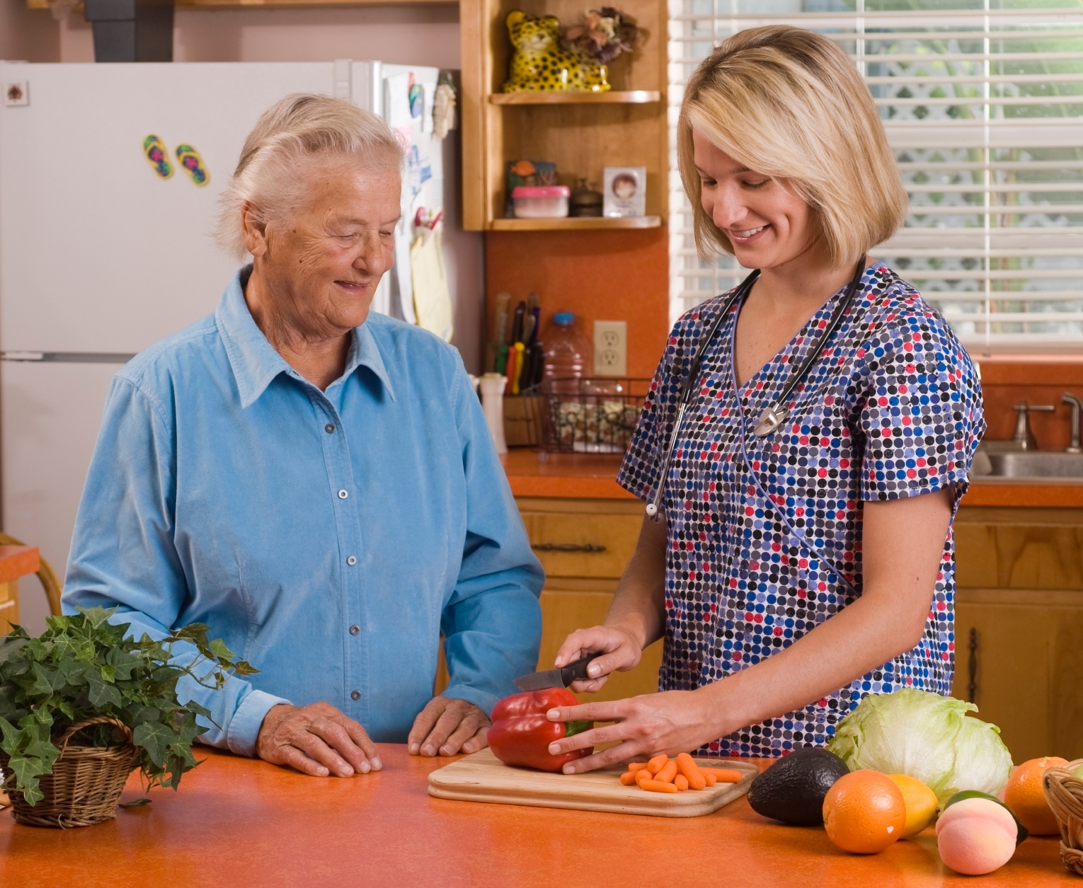 Caregiver helping to prepare meal