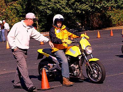 Motorcycle Rider Receiving Safety Instruction