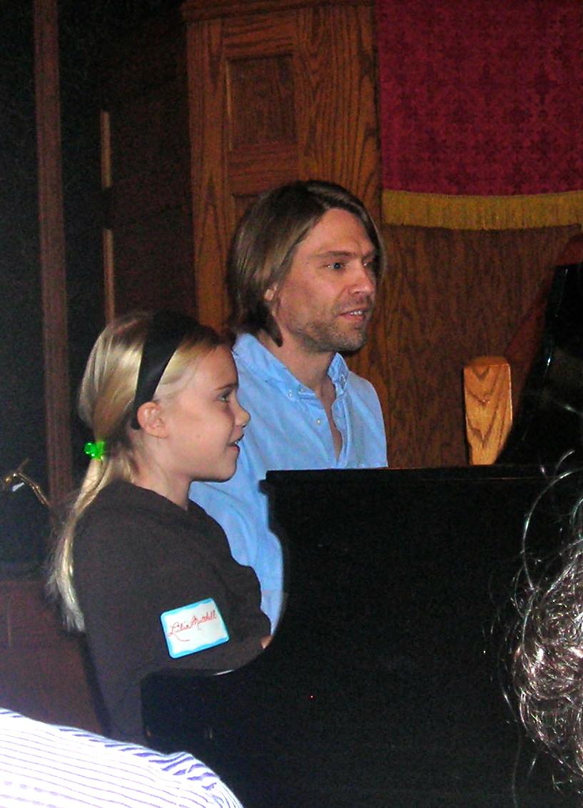 Father and Daughter performing a piano duet!