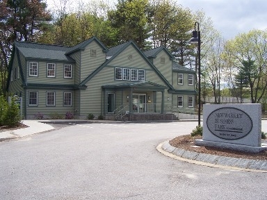 We are in the green building on left hand side of the parking lot.