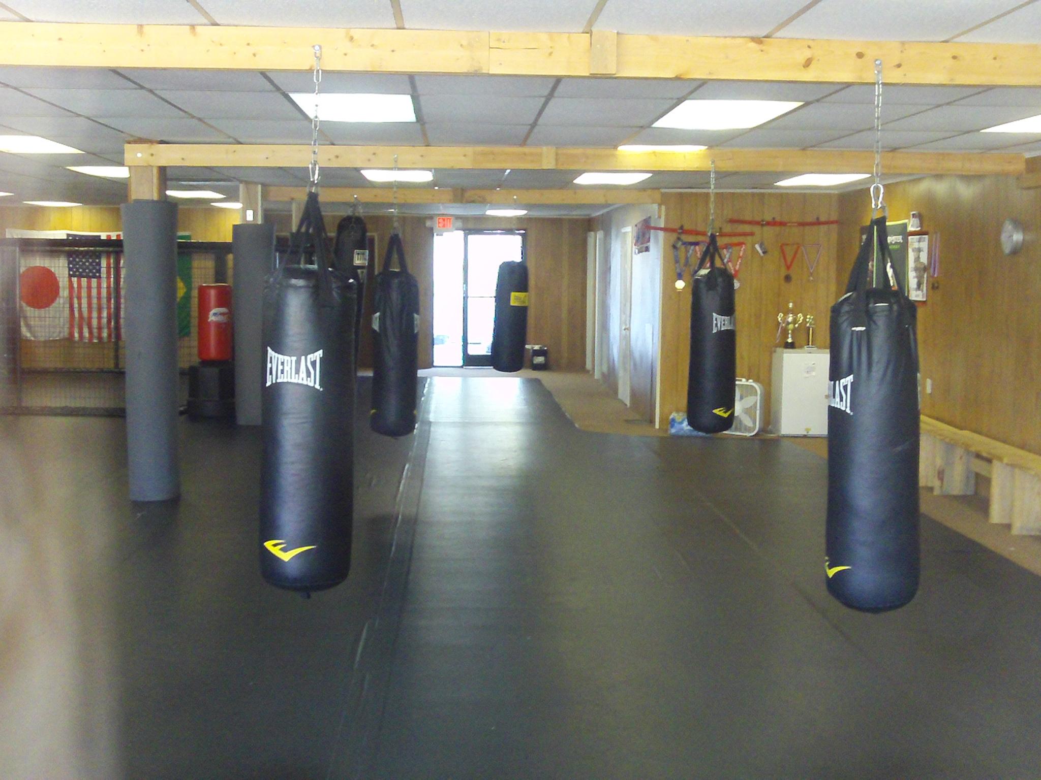 With 2600 sq feet of matt, 8 heavy bags, and the area's only training cage, we are ready for you.