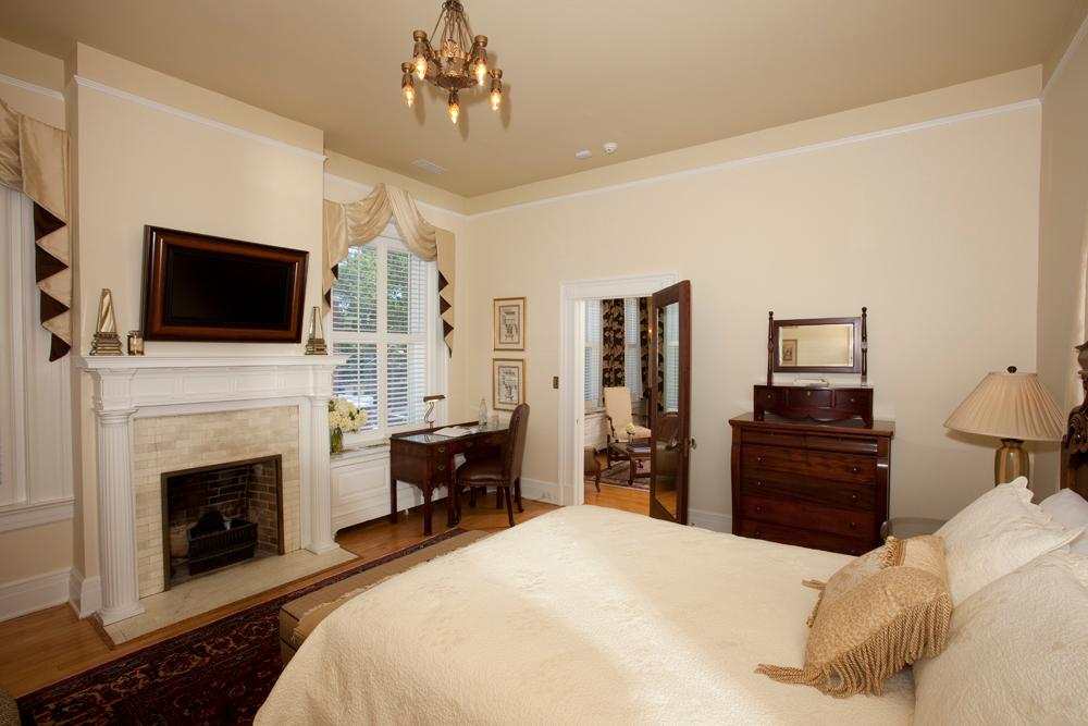 Fontaine Suite offers queen bed, separate sitting room, and working gas fireplace