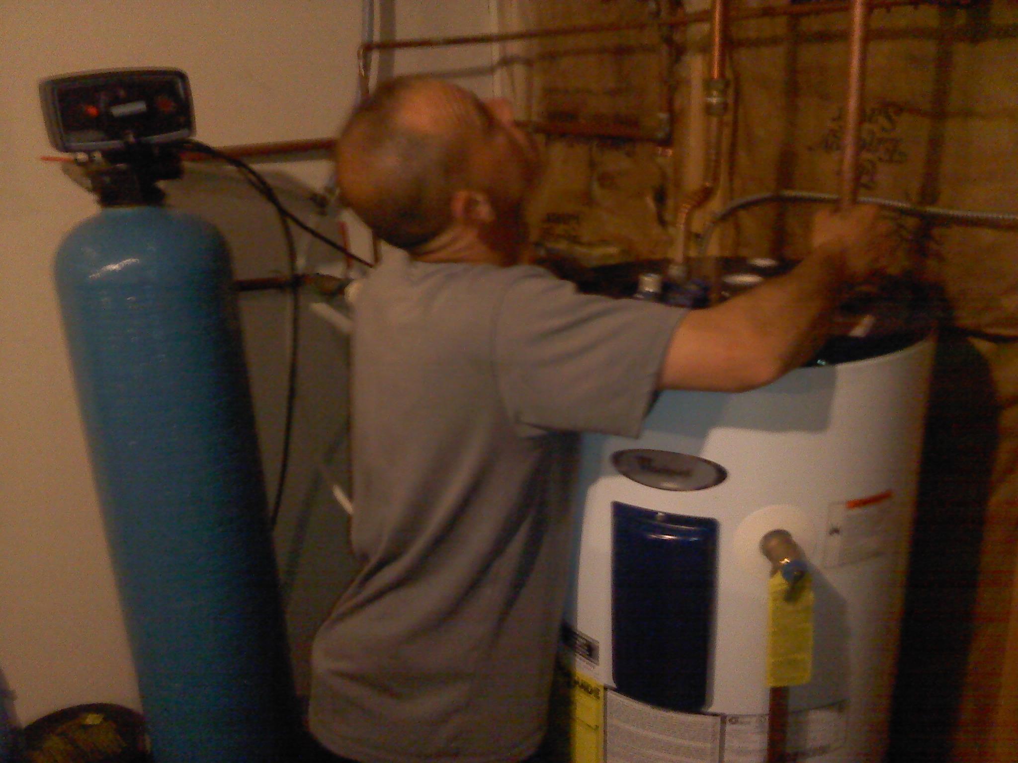 Matt installing a water heater.