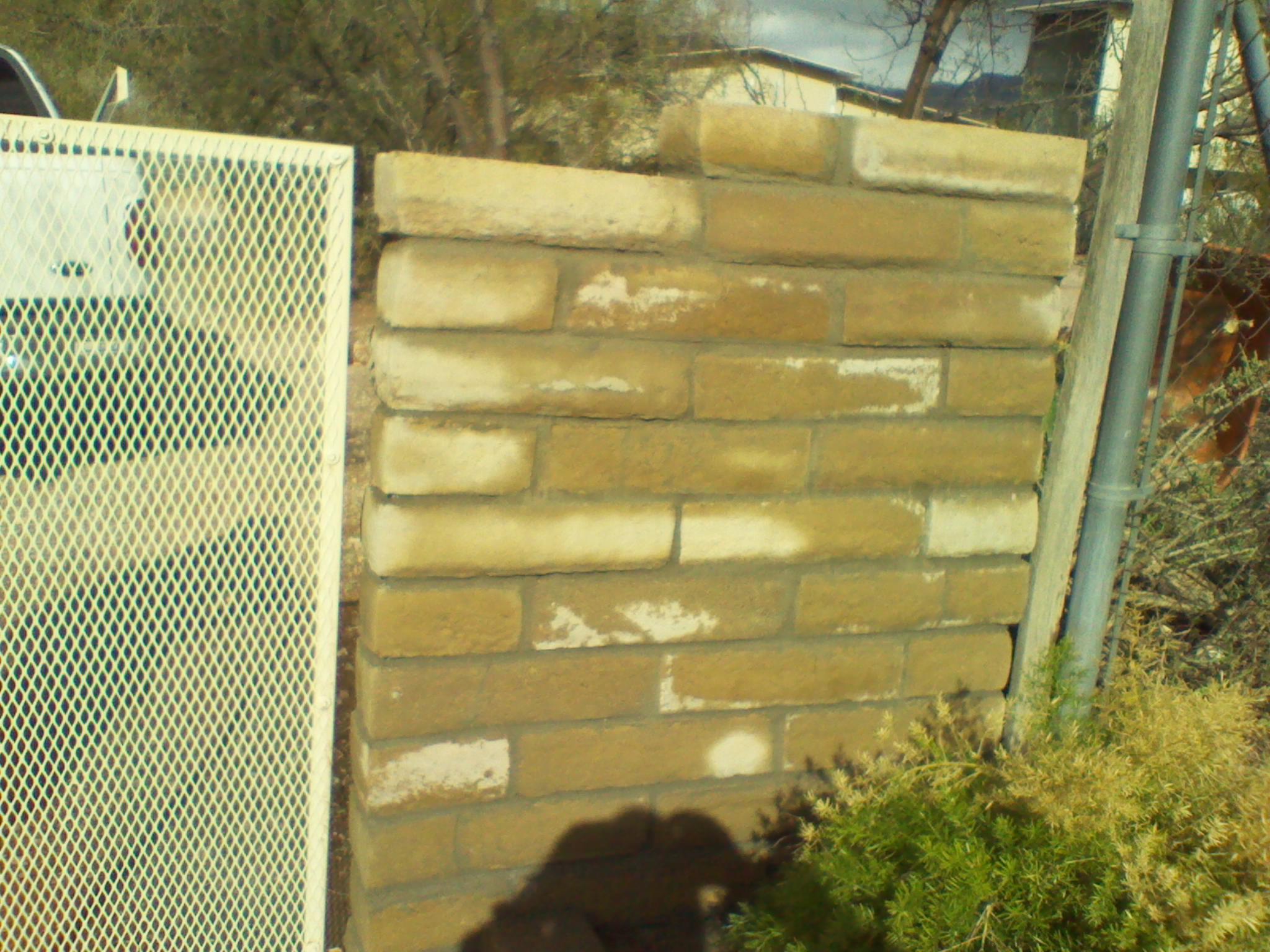 Slump block wall repair. The wall had fallen and we Rebuilt it.