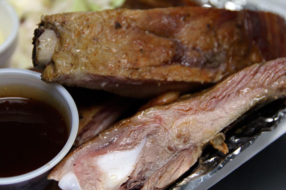 Buford's Smokhouse BBQ ribs plate with coleslaw and banana pudding