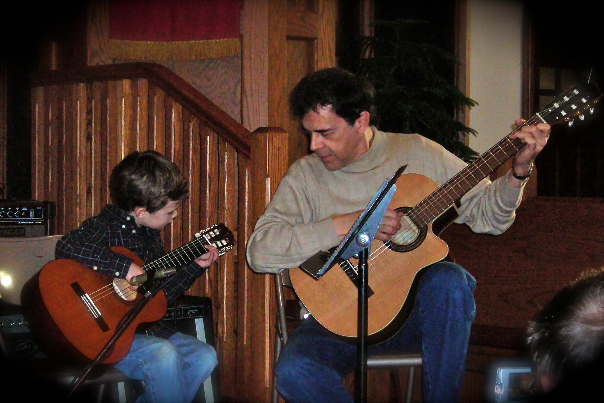 Teacher and Student performing guitar duet in our recital!