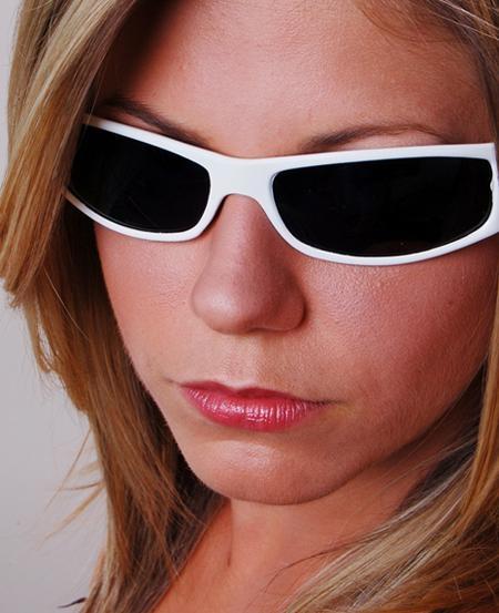 beauty shot of a model with dark sunglasses