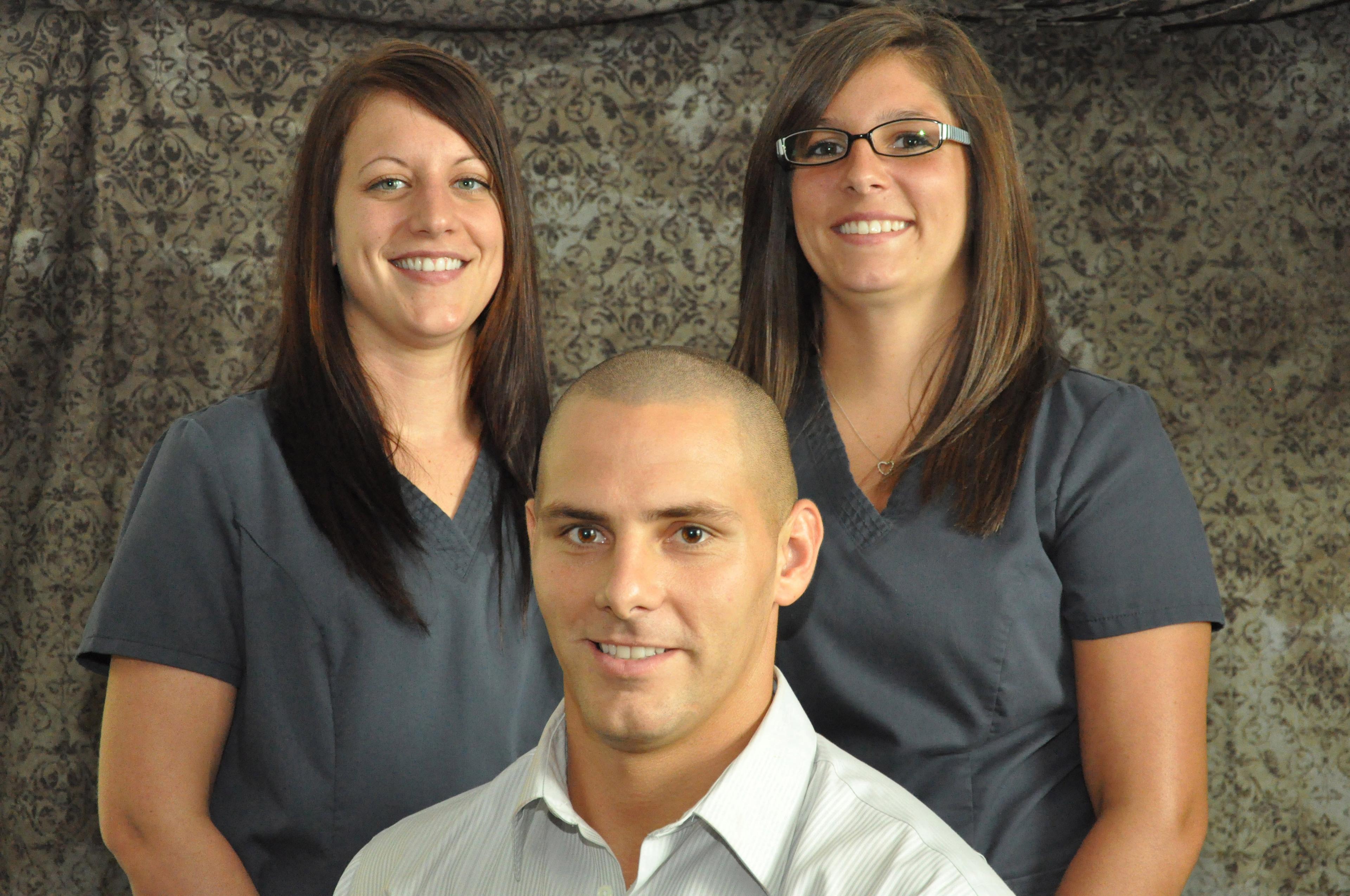 Left to Right: Katie Thompson (Licensed Massage Therapist), Dr. Dustin Pelloquin, Jessica Martin (Chiropractic Assistant)