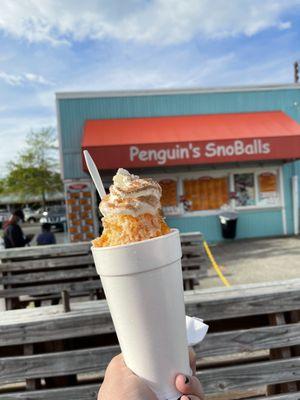 Pumpkin spice deluxe SnoBall stuffed with New York style cheesecake and a scoop of delicious vanilla ice cream