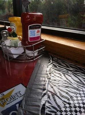 Duct taped broken table and peanut butter smeared ketchup. Cleanliness is not a priority here.