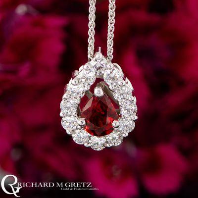 .63ct pear 2.2mm Ruby pendant with .52ctw round Mined Diamond halo and a hidden bail cast in 14kt white gold with a 16"-18" adjustable Spiga