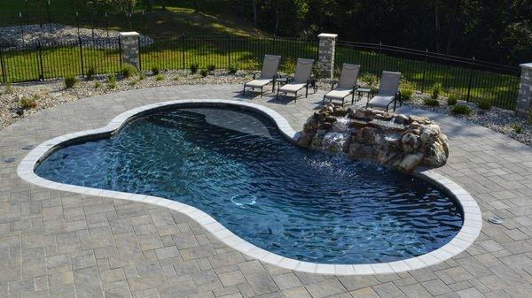 Gunite swimming pool with waterfall.