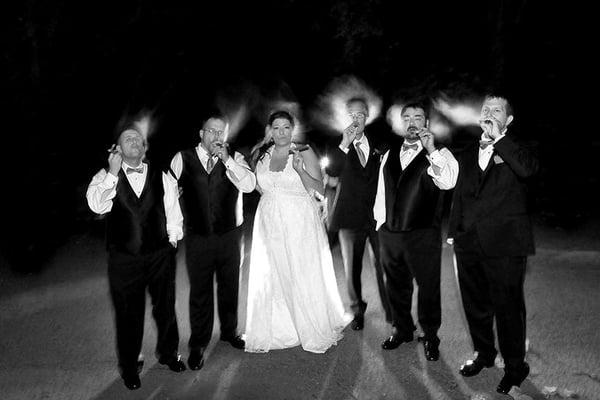 Our bride had to have this photo of her smoking cigars with the groom and his groomsmen...