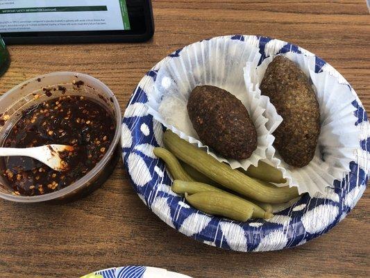 2 enormous Kibbe, delicious and served with a pickled vegetable I've never seen before lol