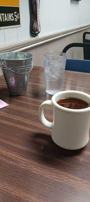 Coffee water and butter and creamer in a bucket