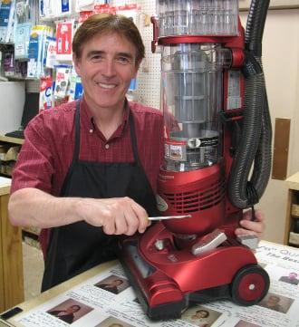 Andy repairing a vacuum.