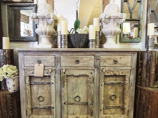 Beautiful buffet arrangement! #buffet #drums #endtable #sidetable #table #cabinet #candles #candlestand #mirrors #statue #wood #wooden