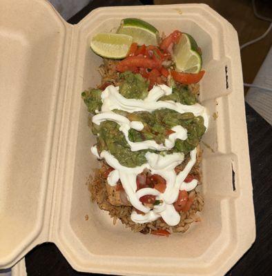 Burrito Bowl. As you can see, the rice barely covered the bottom. It was the same on the other side under the limes.