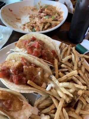 Fish tacos and what's left of the loaded potatoes.