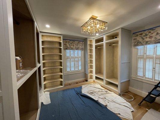 Master closet renovation with custom cabinets and lighting.