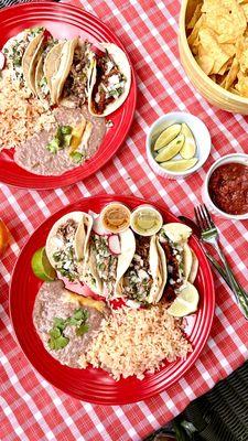 Carnitas, steak and chorizo tacos. Rice and beans are also great.