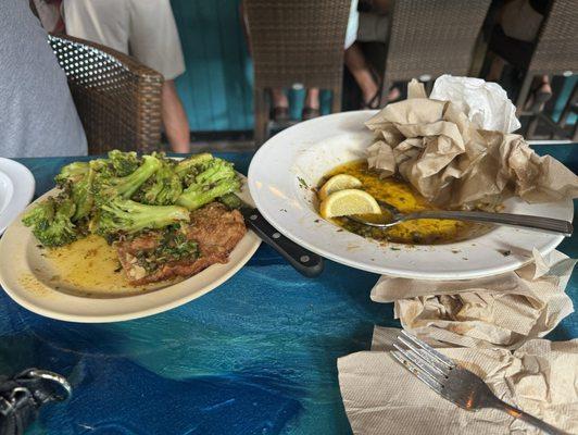 Chicken, piccata, floating and butter note the napkins soaking it up