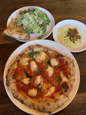 Margherita pizza with a small Caesar salad