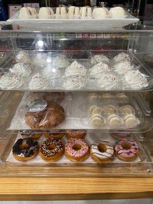 Display case  Meringues Croissant Alfajores Donuts