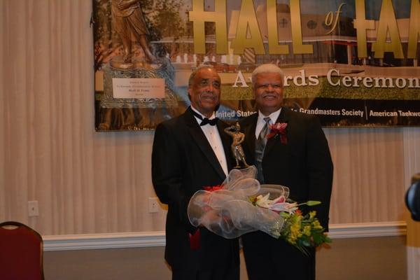 USAT President Bruce Harris presents Hall of Fame honors to Grandmaster Clint Robinson