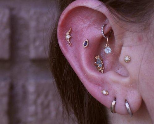 Ear curation with 14k solid gold jewelry