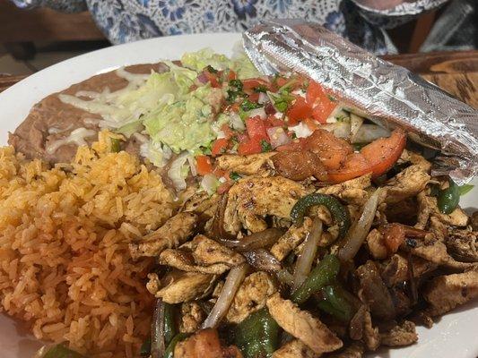 Chicken fajita, rice and refried beans.