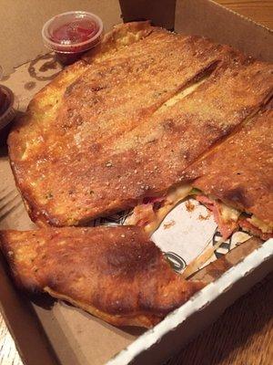 I got a medium Calzone with Canadian bacon,pepperoni  green bell peppers. It's a great size tastes good, delivery on time