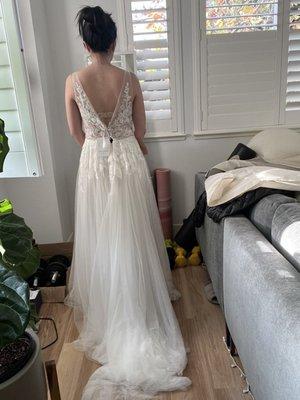 prior to the alteration, the dress is loose around the waist and too long