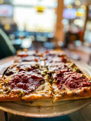 Detroit original style pizza: half pepperoni, half green olives and mushrooms