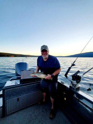 My husband and his 6.75 pound German brown!  We let him go to swim another day!