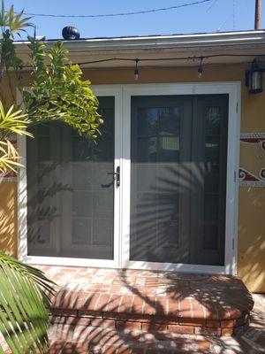 White French Security Screen Doors 94x80 in Long Beach, California. Placed over a set of French doors and sidelights